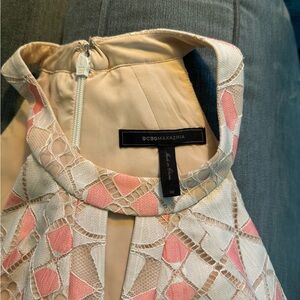 Beautiful lace overlay. Dress color is cream/peach with salmon colored accents.